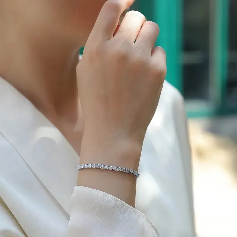 Person wearing bracelet on wrist.