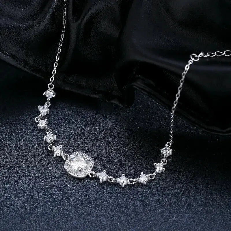 Sterling Silver Chain Bracelet with Moissanite Main Stone and 5 Zircon stones on each side of the main stones -black background