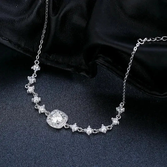 Sterling  Silver Chain Bracelet with Moissanite Main Stone and 5 Zircon stones on each side of the main stones  -black background